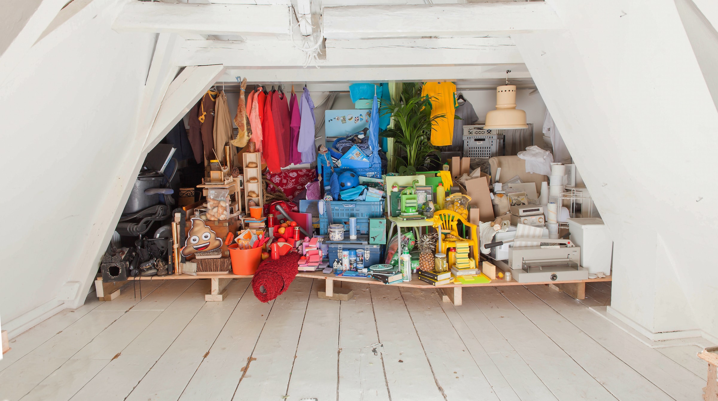 a closet with items organized by color